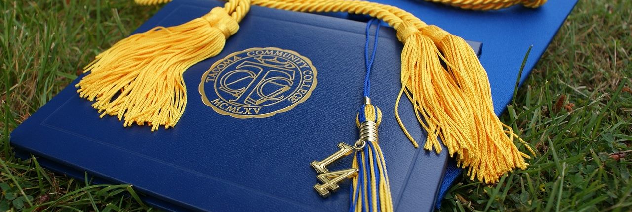 An academic mortarboard hat, representing graduation from further or higher education